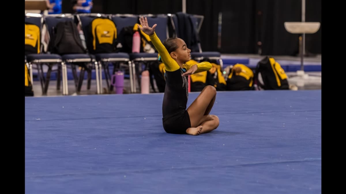 Gymnast performing floor exercise routine in finals