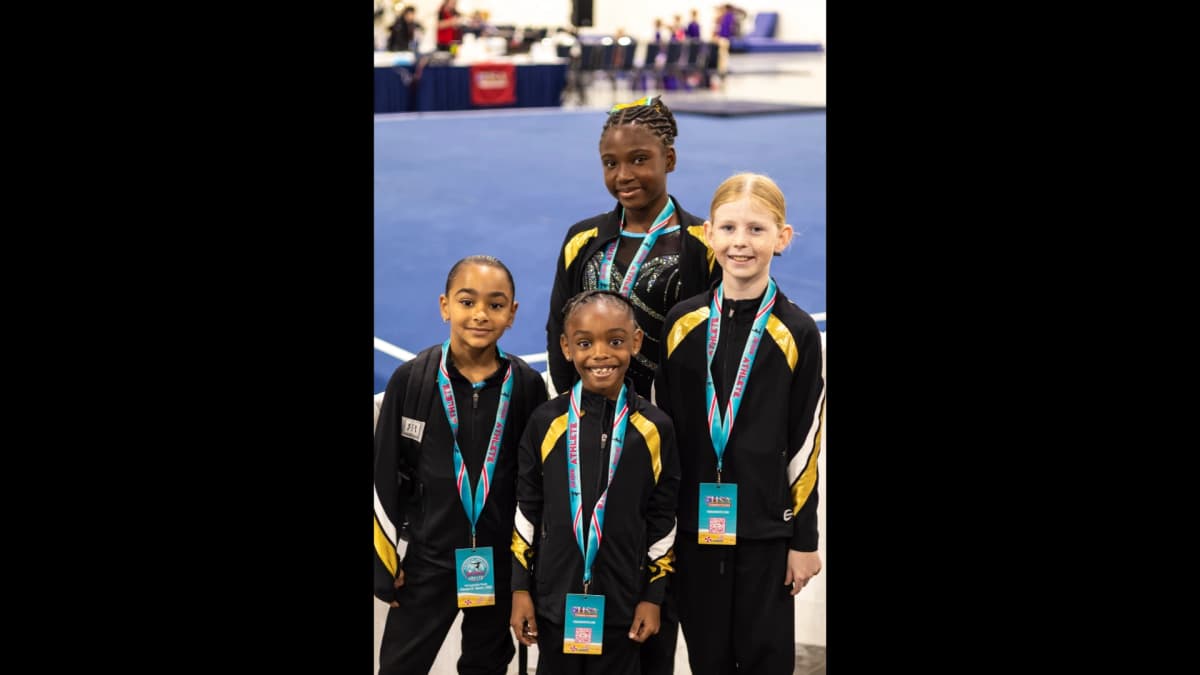 BSG team competing together at gymnastics competition